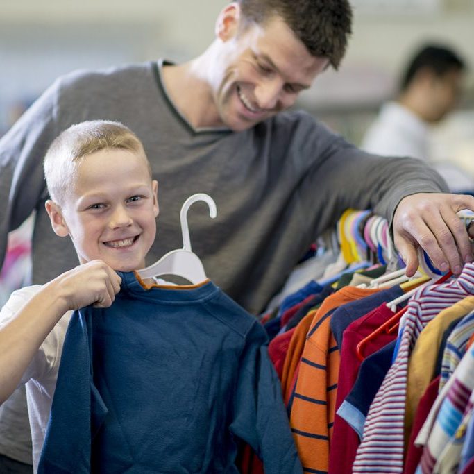 Little boy buying shirt